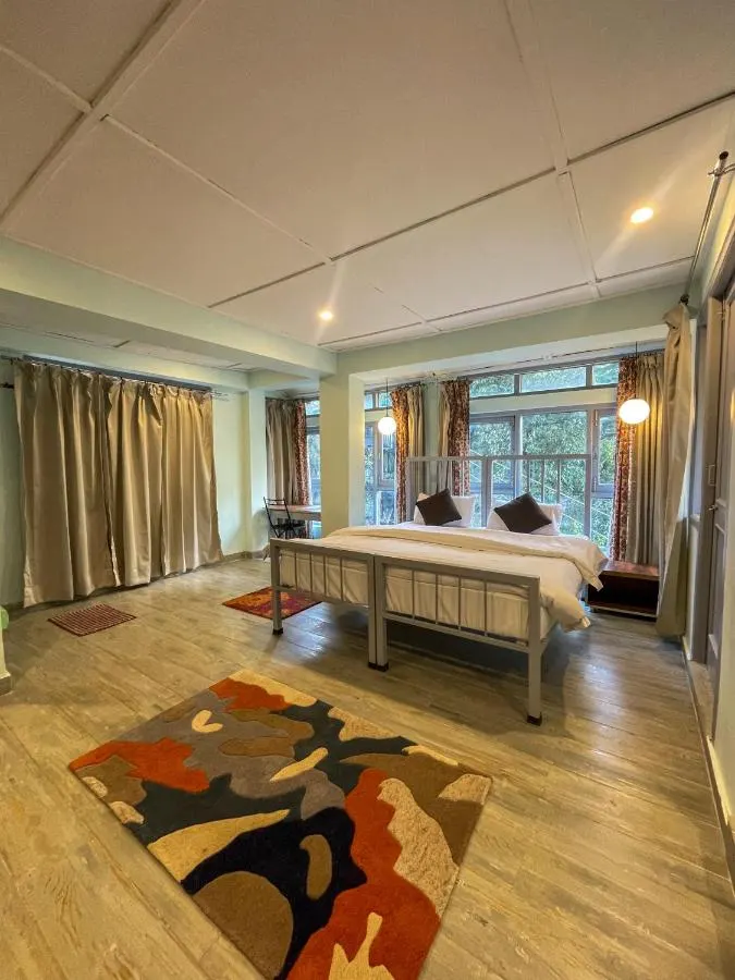 A bright private room with windows on two sides