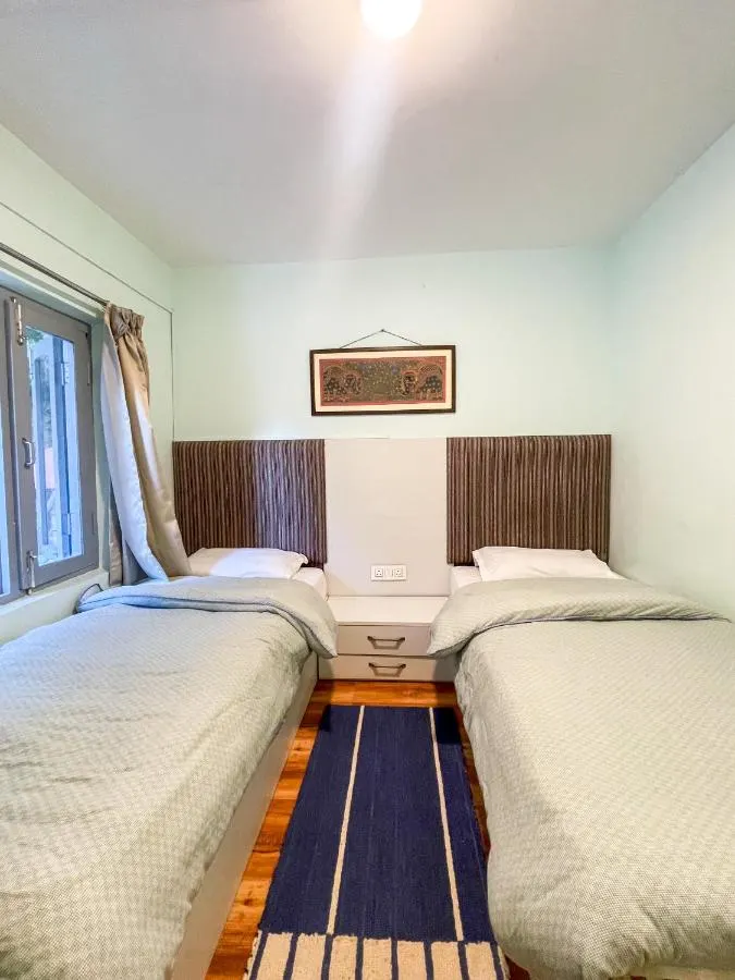 A twin room with two single beds side by side