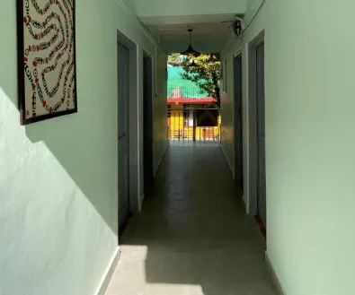 A corridor looking through to the garden beyond