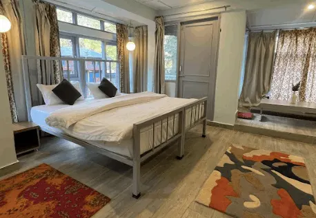 The studio apartment looking towards the balcony doors